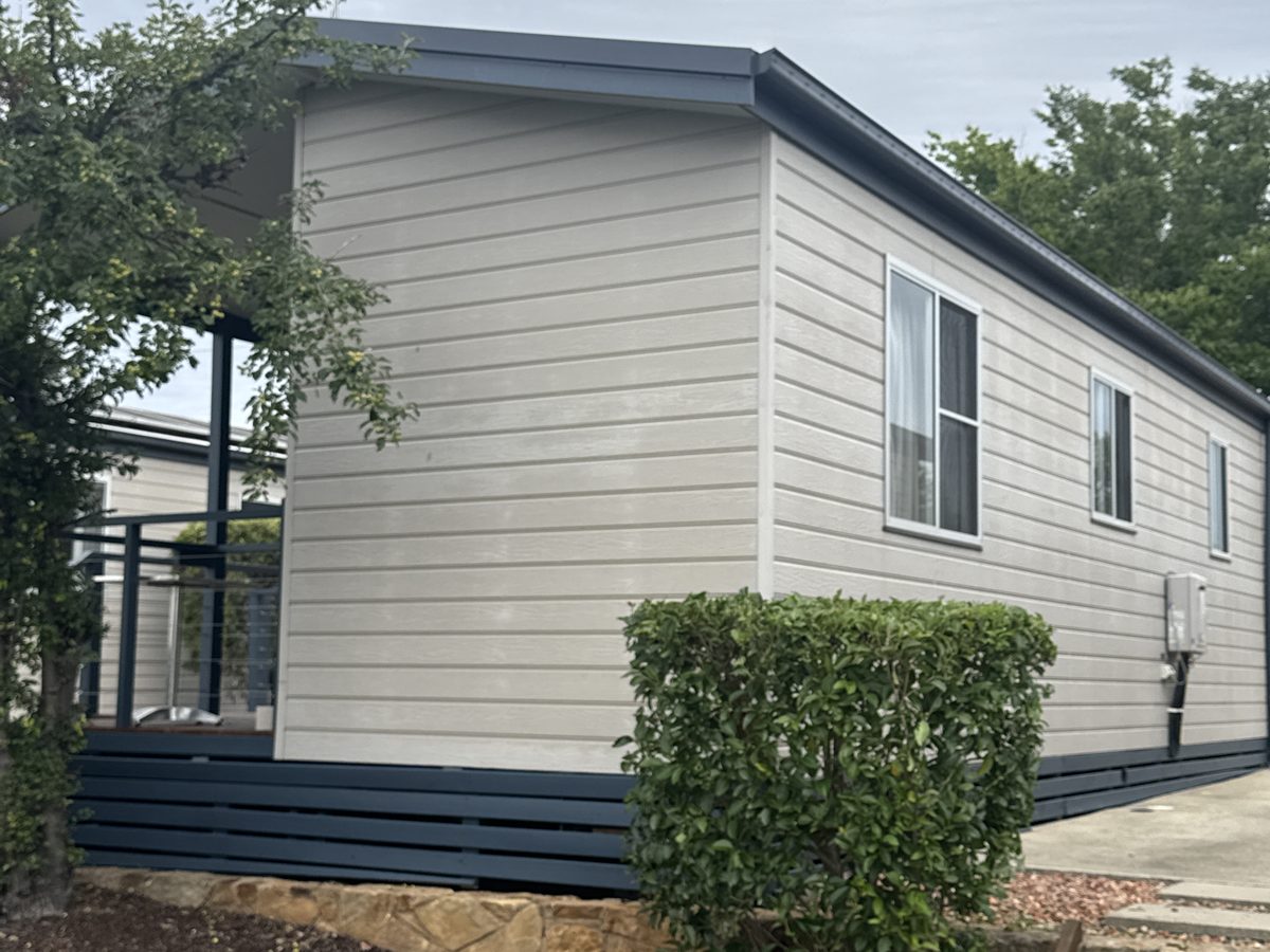 Holiday park cabin before its exterior repaint