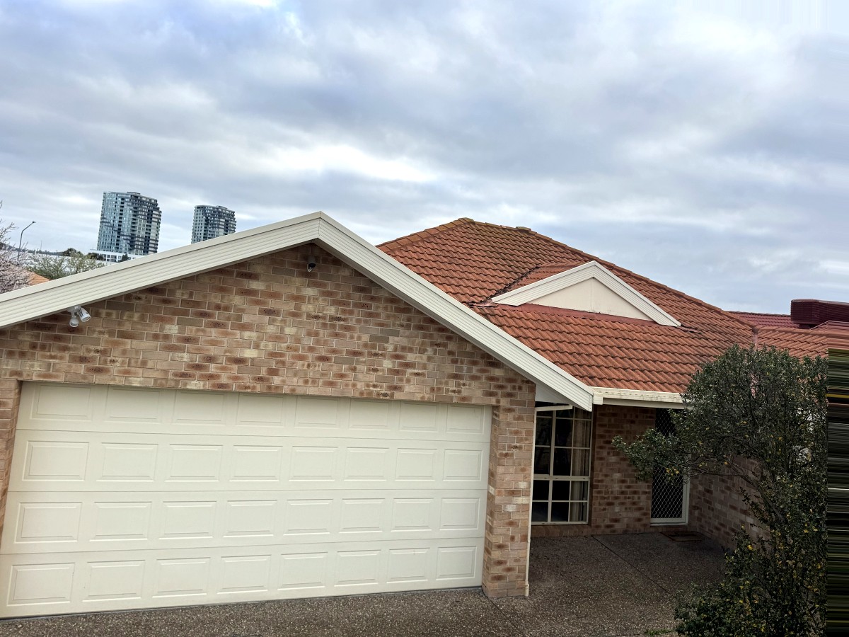 Gungahlin home front elevation before repainting, cream fascia and garage door