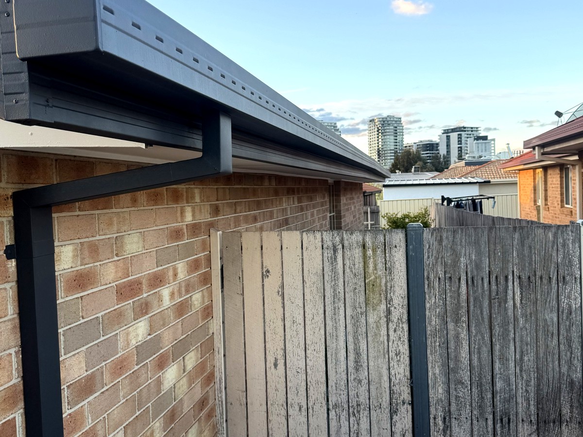 Gutters, fascia and downpipes after repainting in Colorbond Monument, Gungahlin
