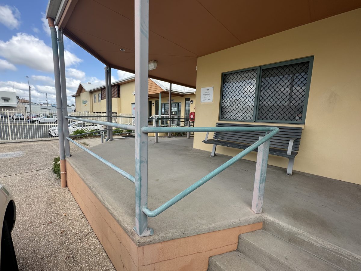 Faded accessibility handrails before their repaint