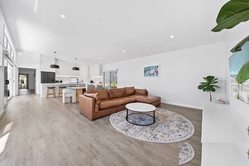 Open-plan living area with timber-look flooring