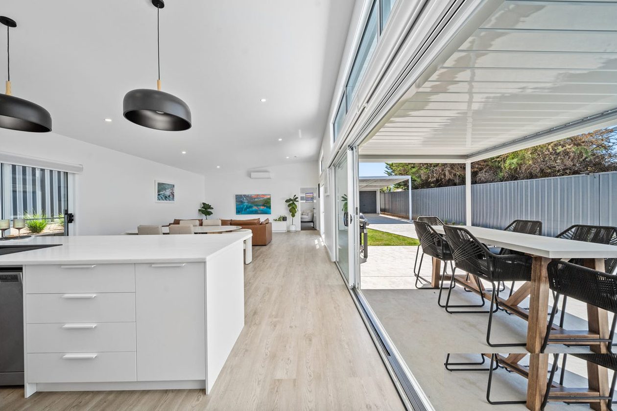 Kitchen opening to outdoor alfresco