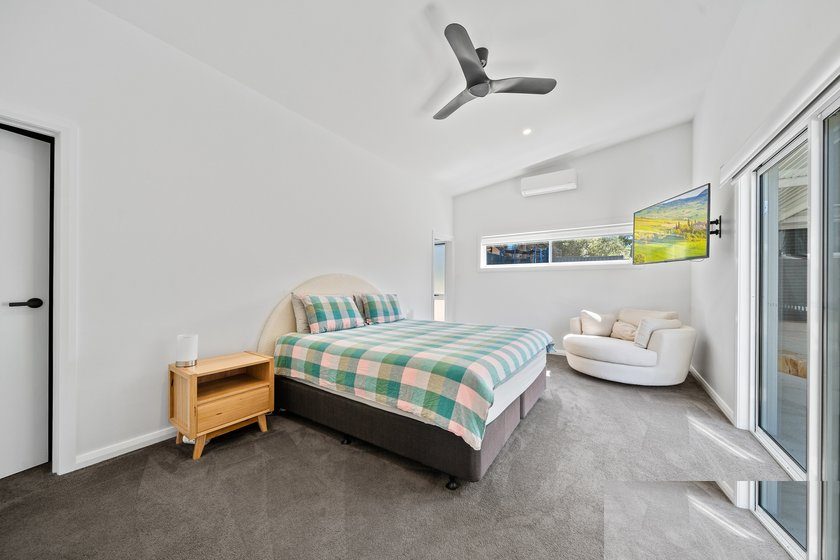 Master bedroom with raked ceiling